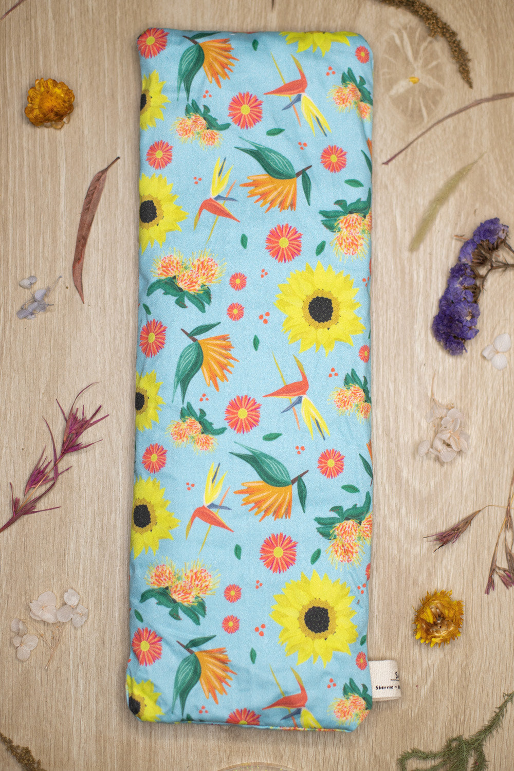 Sherrie Morgan Design wheat pack Bright and Breezy which features sunflowers, birds of paradise and other flora. Lifestyle image.