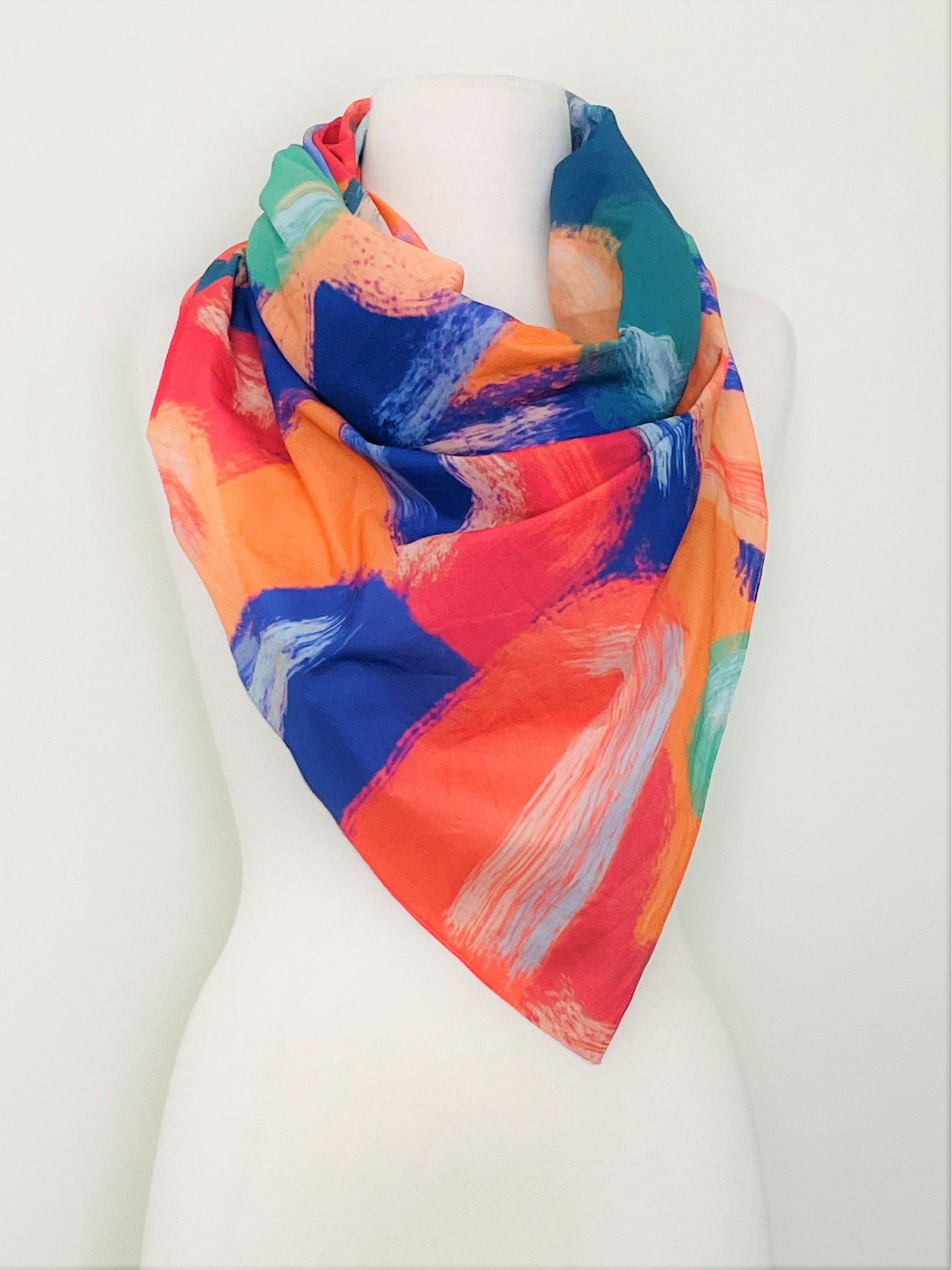 SMD original art 'Party time', vivid orange, blue and green shapes resemble party confetti, displayed as a neck scarf