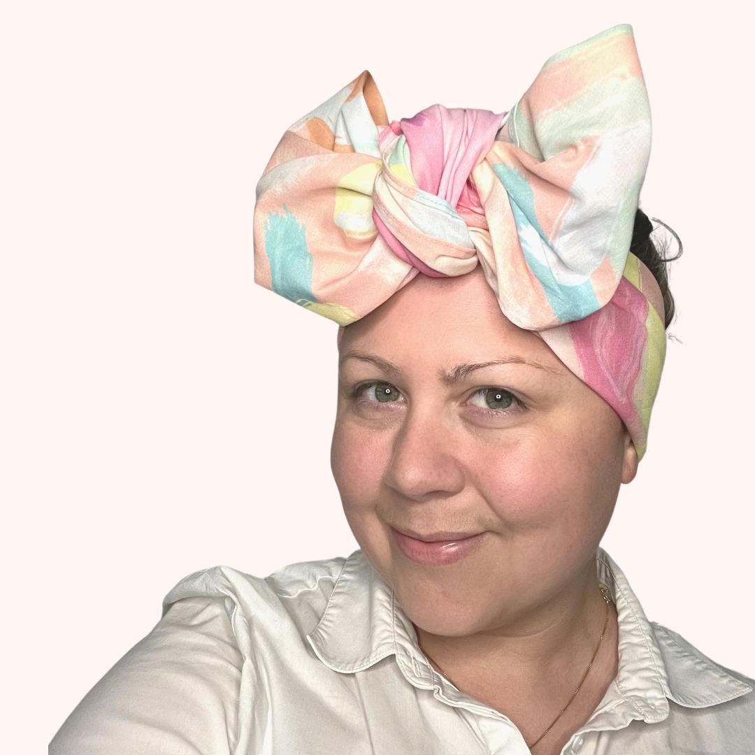 SMD original at 'why not', colourful pastel abstract shapes deisgn, displayed as a headscarf tied in a large bow. Side view