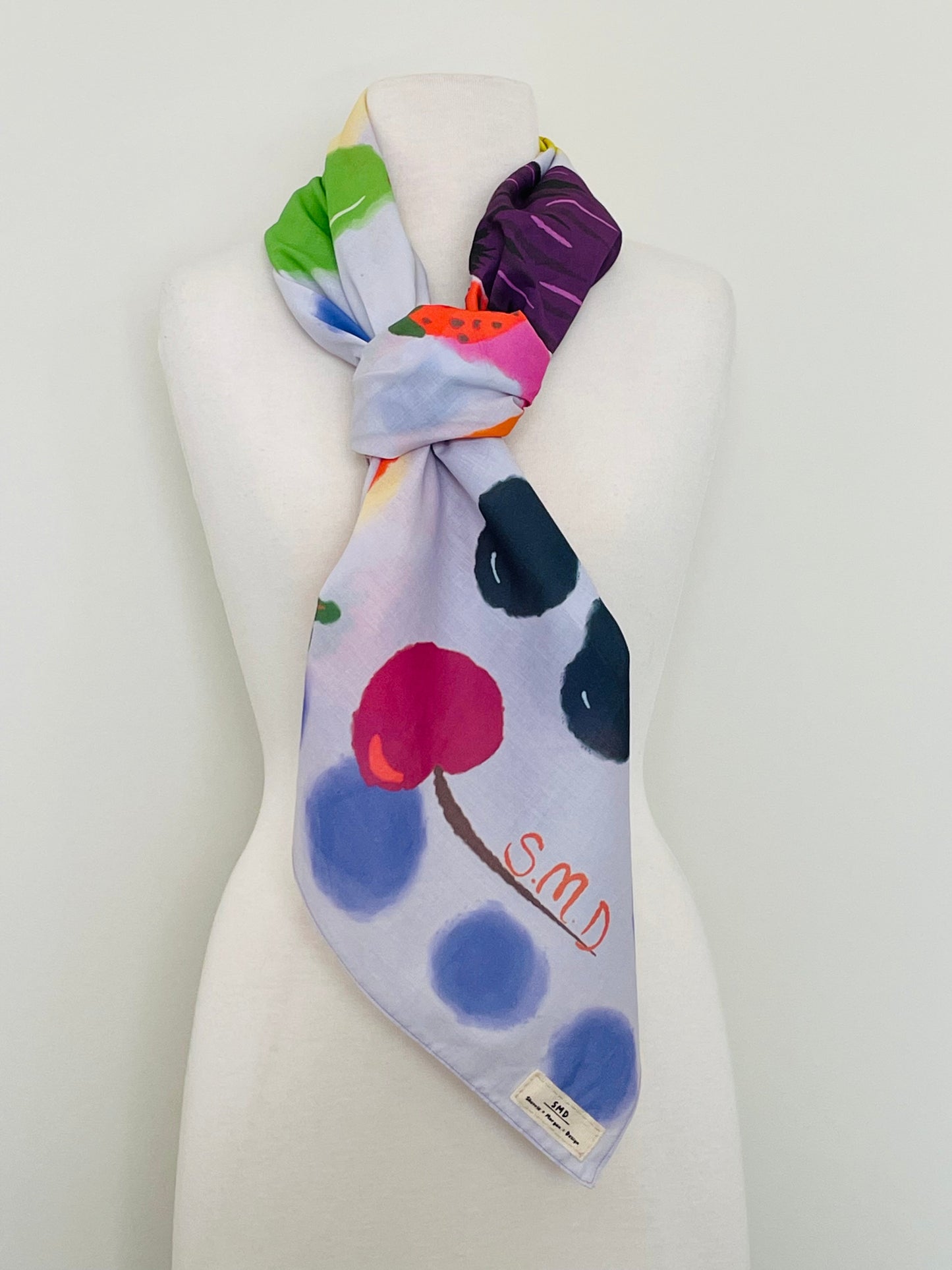 SMD original art 'Fruit Salad', colourful fruit on a lilac base, displayed as a neck scarf.