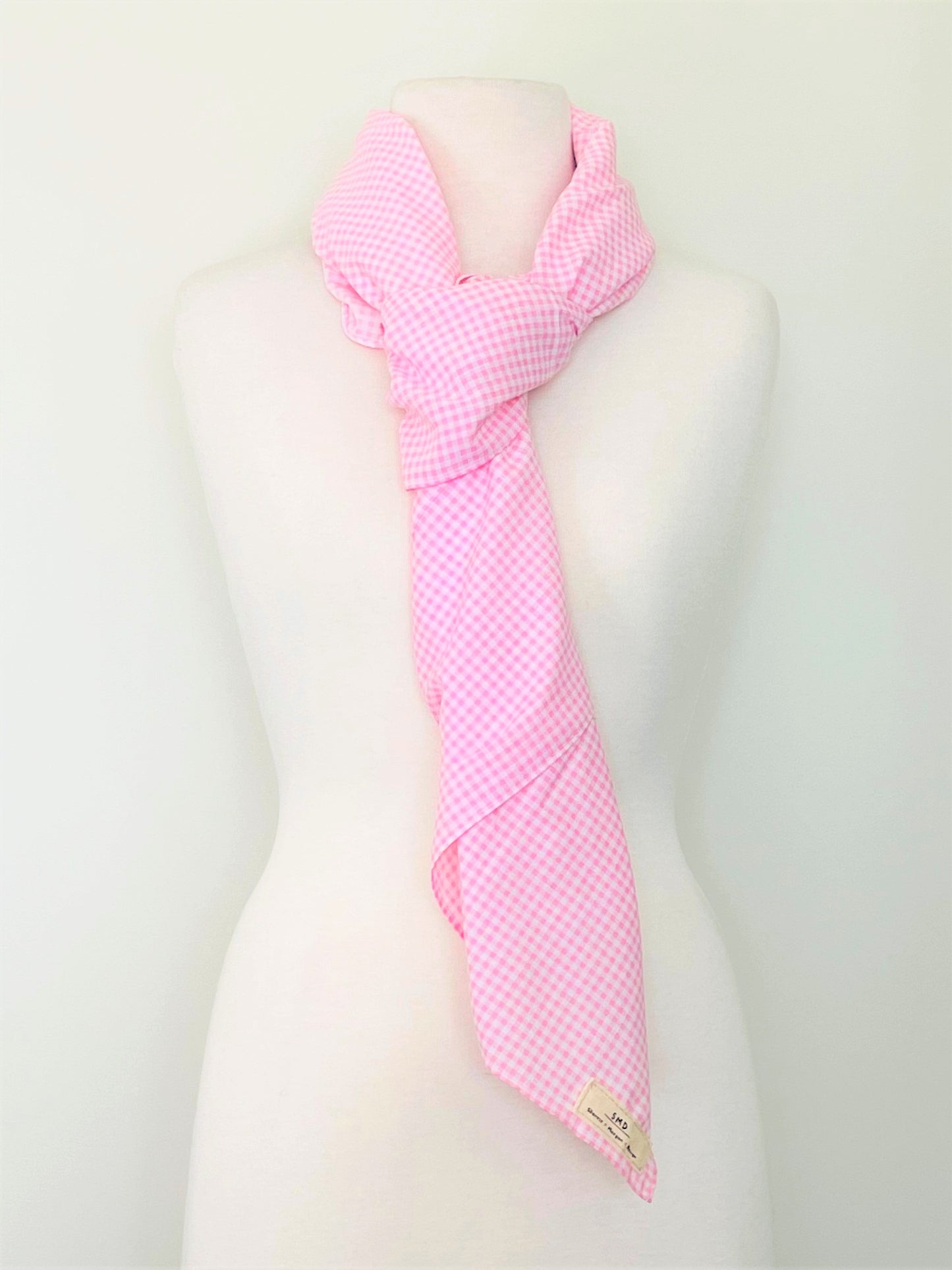 SMD scarf, upcycled pink checkers or gingham fabric, displayed as a neck tie