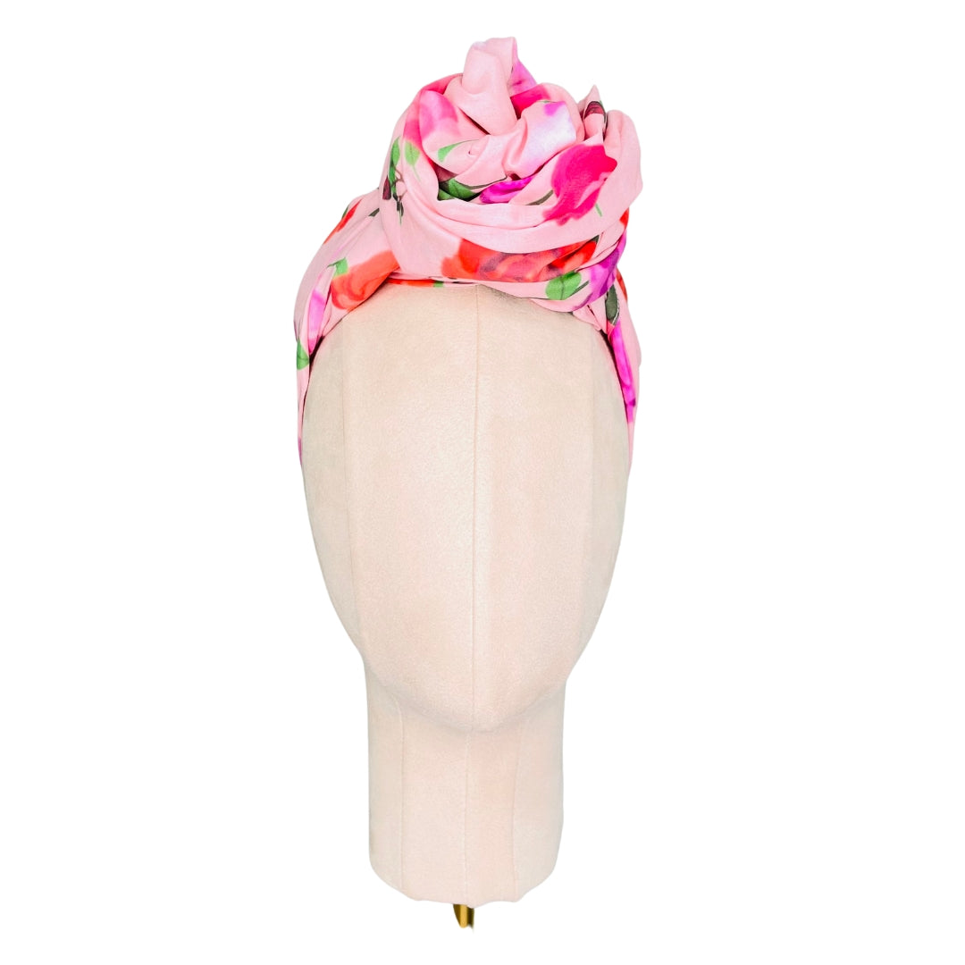 SMD original at 'Roses on Blush', light pink background with pink, red and purple roses. Displayed as a Headscarf. Front view