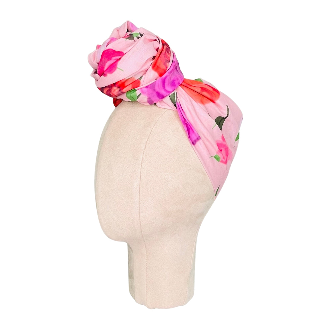 SMD original at 'Roses on Blush', light pink background with pink, red and purple roses. Displayed as a headscarf. Side view