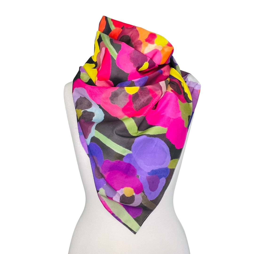 SMD original artwork 'Pretty Pansies', dark background covered in multicoloured pansies. Displayed as a neck scarf