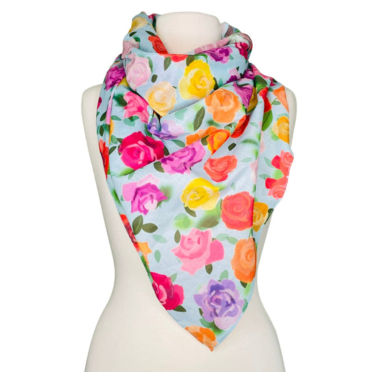 SMD original art 'Rose Garden', baby blue base colour with multi coloured roses on cotton lawn. Displayed as a neck scarf