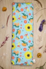 Sherrie Morgan Design wheat pack Bright and Breezy which features sunflowers, birds of paradise and other flora. Lifestyle image.