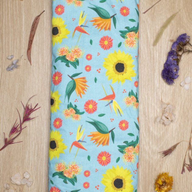 Sherrie Morgan Design wheat pack Bright and Breezy which features sunflowers, birds of paradise and other flora. Lifestyle image.