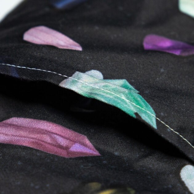 Sherrie Morgan Design relaxing eye pillow with a crystal and cosmic looking design, a close up of the opening of the removable cover.