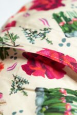 Sherrie Morgan Design relaxing eye pillow with a cactus, rose and other Australian native flowers, close up of opening of the removable cover