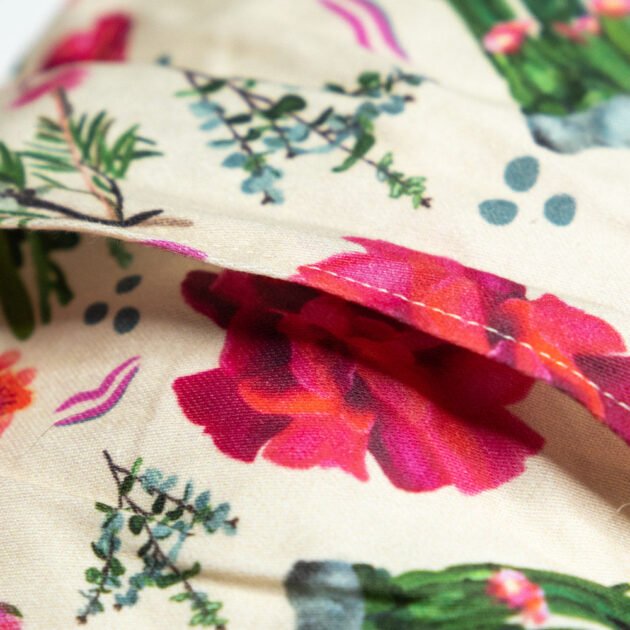 Sherrie Morgan Design relaxing eye pillow with a cactus, rose and other Australian native flowers, close up of opening of the removable cover