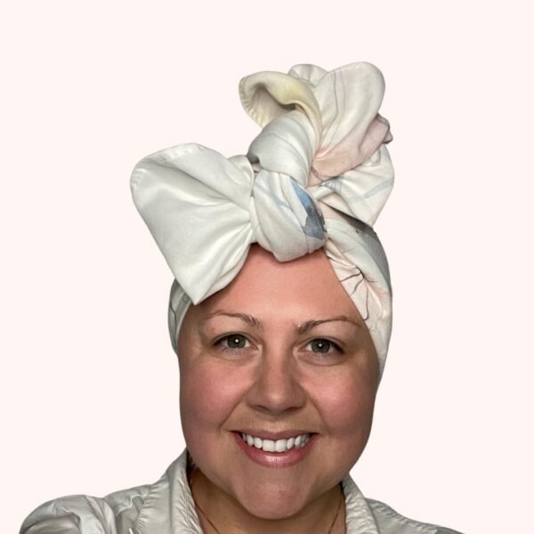 SMD scarf, upcycled, hummingbird print in pastel and charcoal on white base, headwrap with large side bow, front view