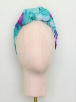 SMD orignal art big splash, a purple heart on turquoise, shown as a knotted head turban. Front View