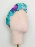SMD orignal art big splash, a purple heart on turquoise, shown as a knotted head turban. Side View