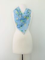 SMD scarf, design by Margaret Jeane,  pears on blue base, scarf displayed as neck scarf