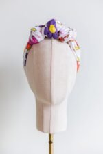 SMD Original art 'Brightside', retro floral print in pink, purple, yellow and white, displayed as a headscarf crown, front view