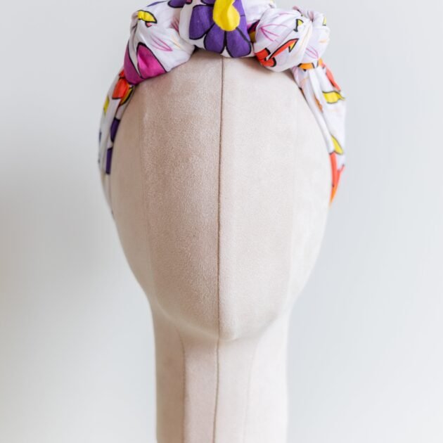 SMD Original art 'Brightside', retro floral print in pink, purple, yellow and white, displayed as a headscarf crown, front view