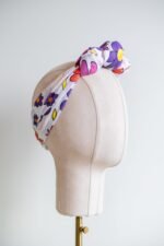 SMD Original art 'Brightside', retro floral print in pink, purple, yellow and white, displayed as a headscarf crown, side view