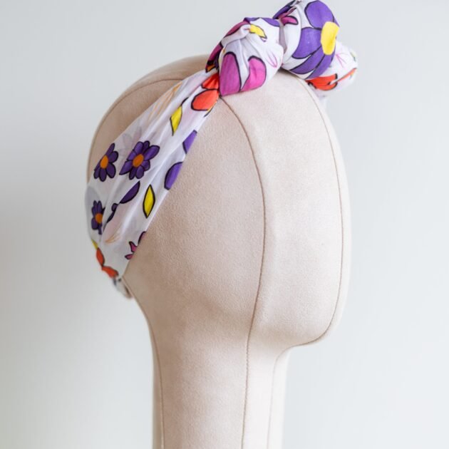 SMD Original art 'Brightside', retro floral print in pink, purple, yellow and white, displayed as a headscarf crown, side view