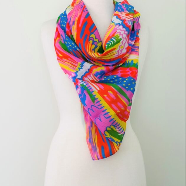 SMD scarf, bright colourful abstract lines pattern, red, yellow, blue, green, pink, shown as neck scarf, design Katie Kortman