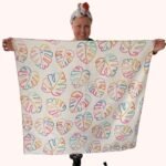 SMD scarf, colourful monstera leaves on a white base, full square scarf shown