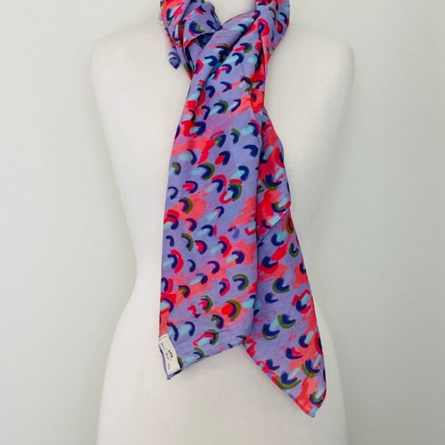 SMD scarf, coral and lilac abstract rain print, by Katie Kortman, displayed as neck scarf