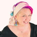 SMD original art scarf, pastel pink with green and blue shapes and abstract design, shown as headscarf with low side bow, side view