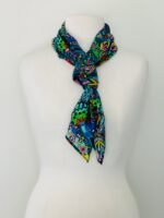 SMD scarf, Miss Moresby abstract multicoloured floral design on a dark grey base, displayed as a neck scarf
