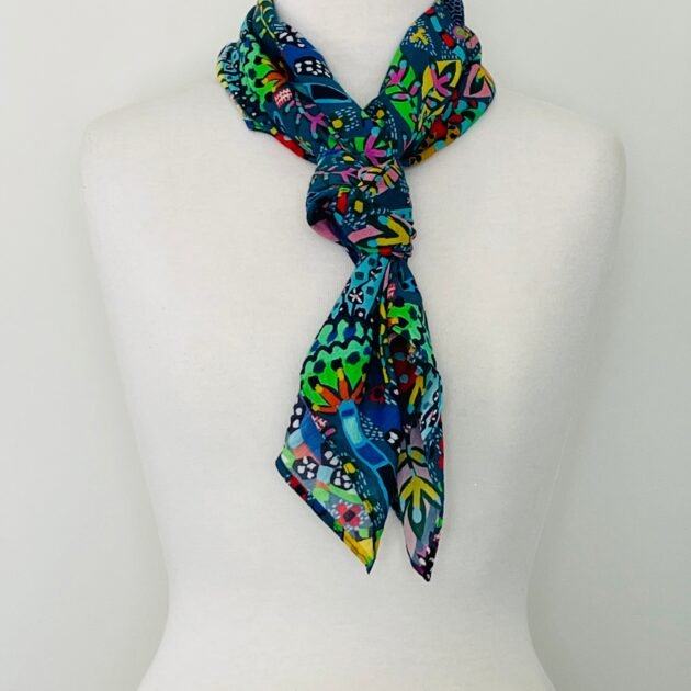SMD scarf, Miss Moresby abstract multicoloured floral design on a dark grey base, displayed as a neck scarf