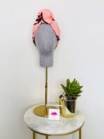 SMD original art 'Hey There', featuring a winking face with red lips on a pink base, displayed as head turban, front view, lifestyle