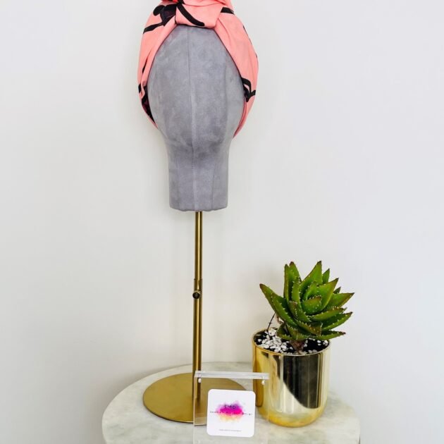 SMD original art 'Hey There', featuring a winking face with red lips on a pink base, displayed as head turban, front view, lifestyle