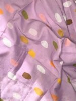 SMD, Lilac base with white, orange and brown coloured spots, fabric close up