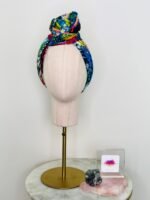SMD scarf, Miss Moresby multicoloured design, displayed as a headscarf, front view