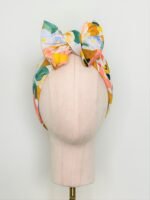 SMD, Pastel floral design, multicoloured, displayed as a headscarf in a large bow, front view