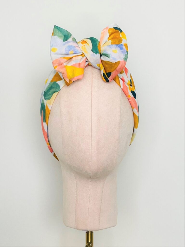 SMD, Pastel floral design, multicoloured, displayed as a headscarf in a large bow, front view