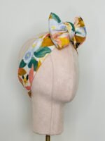 SMD, Pastel floral design, multicoloured, displayed as a headscarf in a large bow, side view