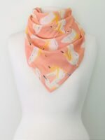 SMD, peachy, birds print on apricot, displayed as neck scarf.
