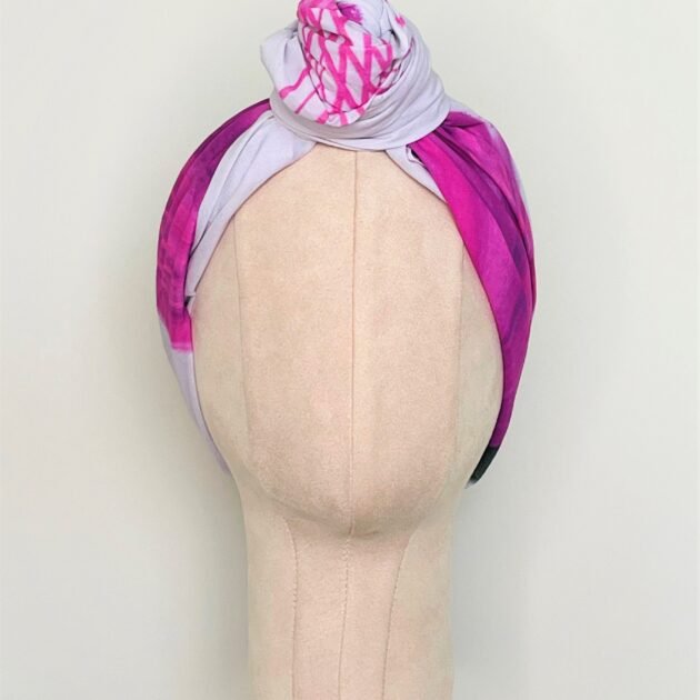 SMD original art 'Protea Party' four pink proteas on a light pink polka dot background, displayed as a headscarf with small top knot, front view