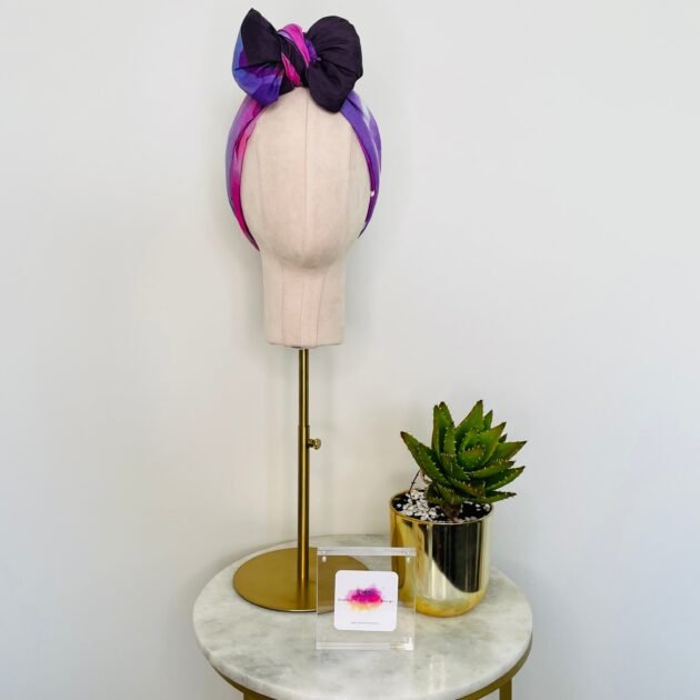 SMD original art 'Protea Party Day', 2 proud purple proteas and purple heart flowers sat in a dark purple frame, shown as a headscarf with bow, front view