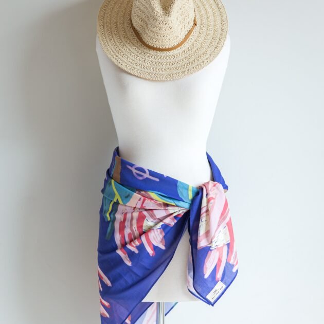 SMD original art 'Protea Multiplied', large pink king protea on a marine blue base, displayed as a sarong