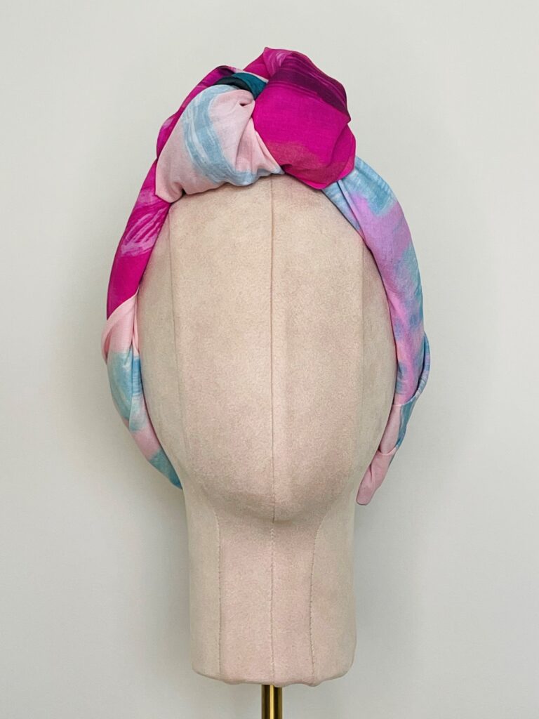 SMD original art 'Retro' an 80's inspired shapes and sketch in pink, grey and blue, displayed as a neck scarf