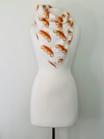 SMD scarf, upcycled fabric featuring a 70's retro floral pattern in yellow and orange, displayed as a neck scarf