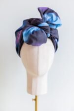 SMD original art 'Spacewalk' dark navy base with chain link, displayed as a head turban with bow, front view.