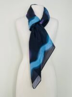 SMD original art 'Spacewalk' dark navy base with chain link, displayed as a neck scarf.