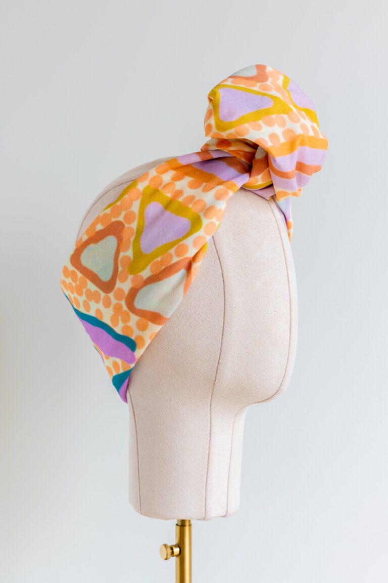 SMD original art 'Under the Sea' colourful peach, purple and green starr seabed, featured as a head wrap with large knot, side view