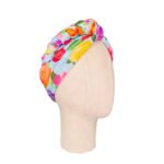 SMD original art 'Rose Garden', baby blue base colour with multi coloured roses on cotton lawn. Displayed as a twisted headscarf. Side view