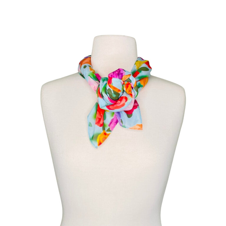 SMD original art 'Rose Garden', baby blue base colour with multi coloured roses on cotton lawn. Displayed as a twisted headscarf. front view